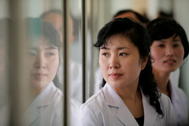 Doctors and staff of the Pyongyang Maternity Hospital accompany foreign reporters during a government organised visit in Pyongyang, North Korea May 7, 2016. (Photo by Damir Sagolj/Reuters)