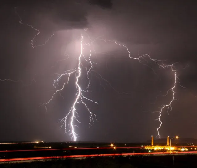 Mass lightning bolts light up night skies by Daggett airport from monsoon storms passing over the high deserts early Wednesday, north of Barstow, California, July 1, 2015. Picture taken using long exposure. (Photo by Gene Blevins/Reuters)