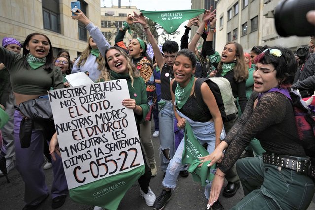 Abortion-rights activists celebrate the anniversary of the Constitutional Court's decriminalization of abortion, lifting all limitations on the procedure until the 24th week of pregnancy, in Bogota, Colombia, Tuesday, Feb. 21, 2023. (Photo by Fernando Vergara/AP Photo)