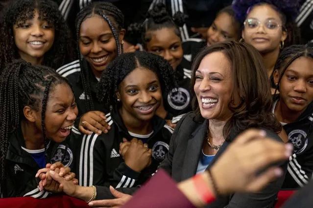 Vice President Kamala Harris greets members of the Detroit Youth Choir at a vaccine mobilization event at the TCF Center in Detroit, Monday, July 12, 2021. (Photo by Andrew Harnik/AP Photo)