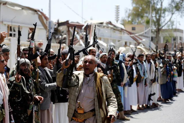 Tribesmen loyal to the Houthi raise up their rifles during a gathering to show support to the movement in Sanaa, Yemen, May 19, 2016. (Photo by Khaled Abdullah/Reuters)