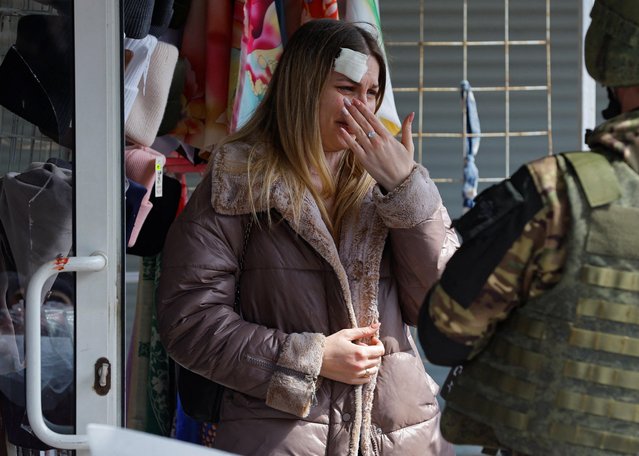 A woman reacts at the scene of recent shelling at a local market in the course of Russia-Ukraine conflict, in Donetsk, Russian-controlled Ukraine on April 7, 2023. (Photo by Alexander Ermochenko/Reuters)