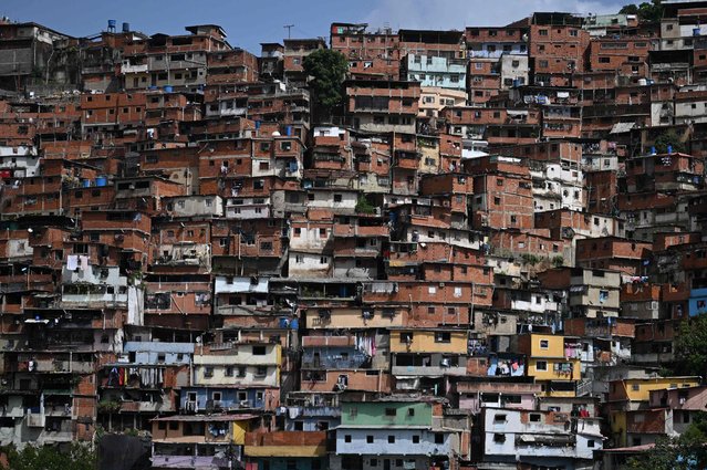 Houses are pictured in Petare Shantytown, Caracas on July 22, 2024. Venezuela will hold general election next July 28 (Photo by Raul Arboleda/AFP Photo)