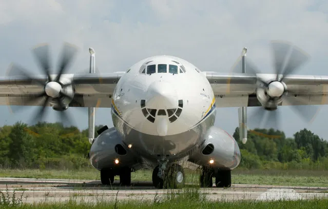 An Antonov An-22A “Antei” (Antheus), believed to be the world's largest turboprop powered aircraft, is seen on the tarmac of the Antonov aircraft plant before the first demonstration flight after the plane's renovation in Kiev, Ukraine, May 30, 2016. (Photo by Valentyn Ogirenko/Reuters)
