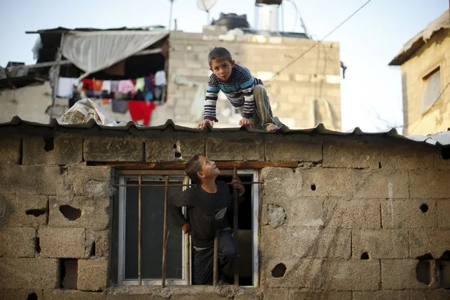 Palestinian boys play at their family house in Biet Lahiya town in the northern Gaza Strip March 24, 2015. (Photo by Mohammed Salem/Reuters)