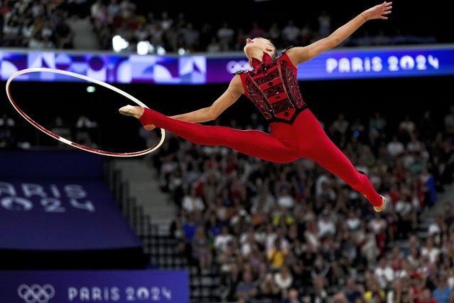 Taisiia Onofriichuk, of Ukraine, performs her hoop exercise in the rhythmic gymnastics individuals all-round qualification round at La Chapelle Arena at the 2024 Summer Olympics, Thursday, August 8, 2024, in Paris, France. (Photo by Francisco Seco/AP Photo)