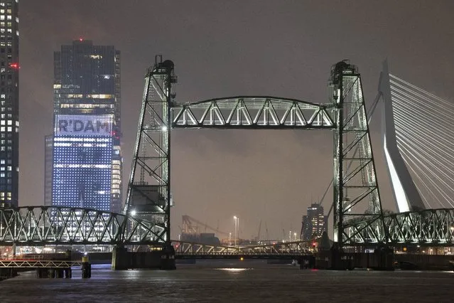 View of the Koningshaven Bridge, known as De Hef, (The Lift), in Rotterdam, Netherlands, Thursday, February 3, 2022. A plan to dismantle the historic bridge in the heart of Dutch port city so that a huge yacht, reportedly being built for Amazon founder Jeff Bezos, can get to the North Sea is unlikely to be plain sailing. Reports this week that the city had already agreed to take apart the recently restored bridge sparked anger in the city, with one Facebook group set up calling for people to pelt the multimillion dollar yacht with rotten eggs. (Photo by Peter Dejong/AP Photo)