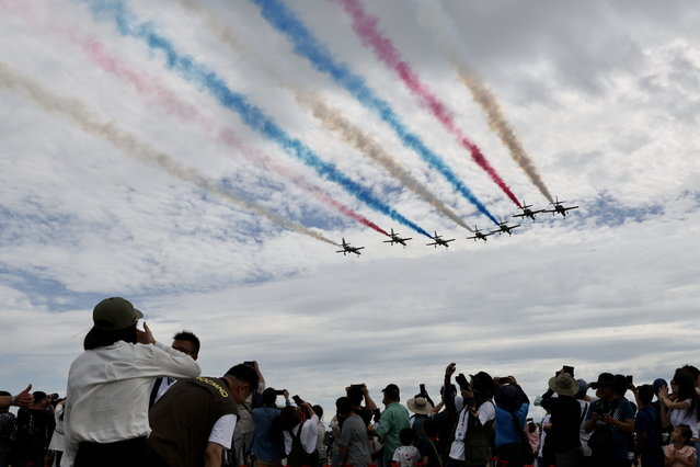 Taiwan's Air Forces Thunder Tiger Aerobatics Team jets perform during an open house event inside Taiwanese Air Base in Taichung, Taiwan, 12 August 2023. China stated on 11 August that it will conduct three days of military drills in the East China Sea, one day before Taiwan Vice President William Lai is supposed to leave for a trip to Paraguay with a stopover in the USA. (Photo by Ritchie B. Tongo/EPA)