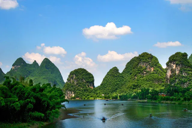 File photo taken on July 24, 2011 shows the scenery of karst landform in the scenic spot of Lijiang River in Guilin, south China's Guangxi Zhuang Autonomous Region. The World Heritage Committee on Monday inscribed an extension of South China Karst, a natural World Heritage Site since 2007, into the UNESCO's World Heritage List. (Photo by Wang Cuirong/Xinhua)