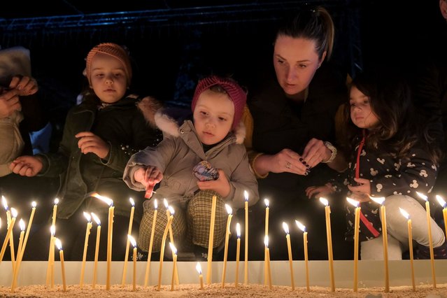 People light candles for the victims of the Wednesday's shooting rampage in Cetinje, in Podogrica, Montenegro, Thursday, January 2, 2025. (Photo by Risto Bozovic/AP Photo)