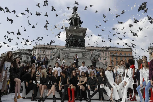 Models wear creations part of the SSheena women's Spring-Summer 2018 collection, that was presented in front of the Duomo gothic cathedral, in Milan, Italy, Monday, September 25, 2017. (Photo by Luca Bruno/AP Photo)