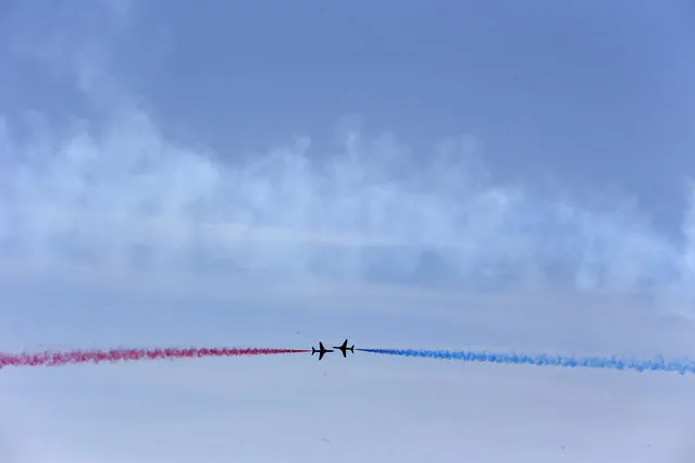 The Royal Air Force aerobatic team, the Red Arrows, perform during a D-Day event in Portsmouth, southern England, June 5, 2014. (Photo by Stefan Wermuth/Reuters)