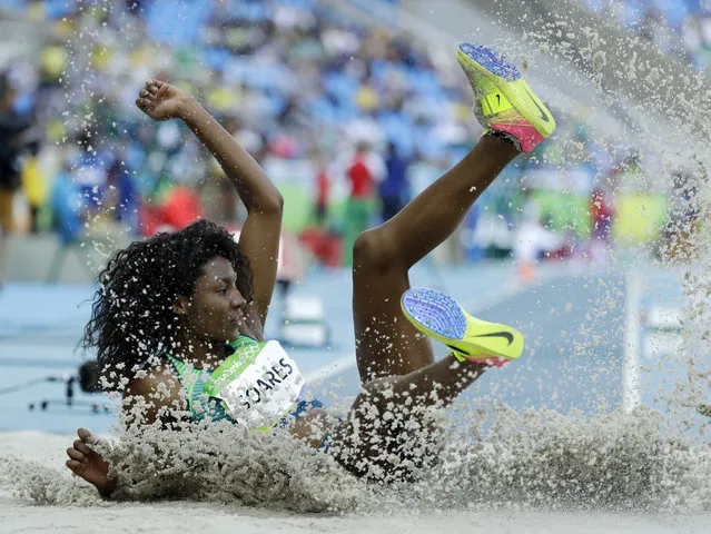 Brazil's Nubia Soares competes in a qualifying round of the women's triple jump during the athletics competitions of the 2016 Summer Olympics at the Olympic stadium in Rio de Janeiro, Brazil, Saturday, August 13, 2016. (Photo by Matt Dunham/AP Photo)