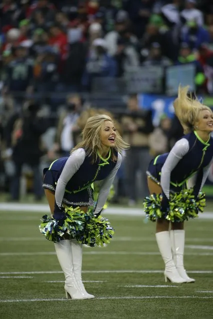 Seattle Seahawks cheerleaders perform during the first half of the NFL football NFC Championship game against the San Francisco 49ers Sunday, January 19, 2014, in Seattle. (Photo by Matt Slocum/AP Photo)