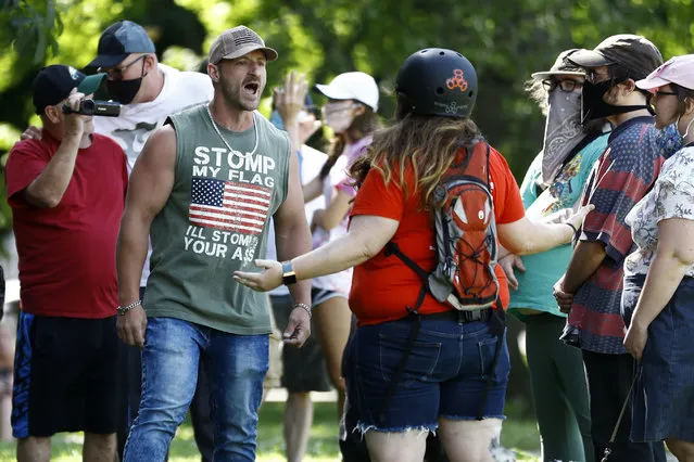 A man yells at a protester near the statue of Christopher Columbus at Marconi Plaza, Monday, June 15, 2020, in the South Philadelphia neighborhood of Philadelphia. (Photo by Matt Slocum/AP Photo)