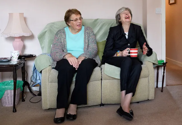 Britain's Prime Minister Theresa May meets resident Val Lay (left) during a visit to a housing estate in north London, England on November 16, 2017. (Photo by Leon Neal/Reuters)