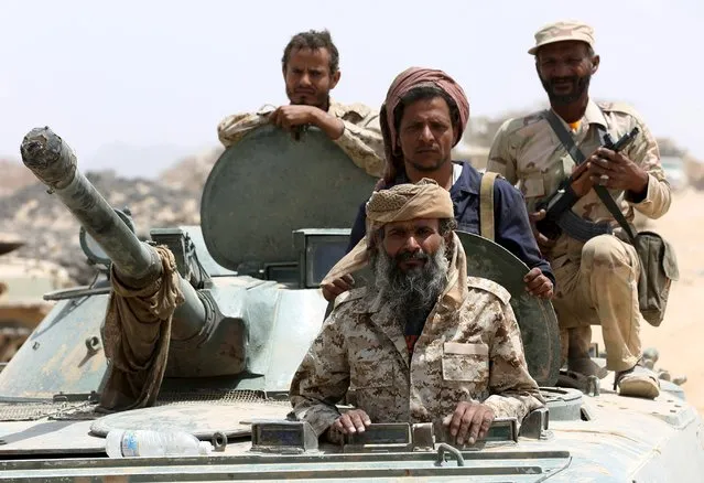 Soldiers loyal to Yemen's government ride on an armoured vehicle in the frontline province of Marib, September 20, 2015. (Photo by Reuters/Stringer)