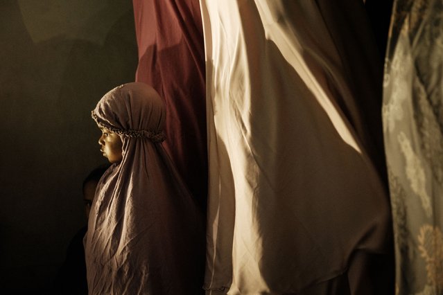 A girl offers Tarawih prayers to mark the start of the Islamic holy month of Ramadan at the Baiturrahman Grand Mosque in Banda Aceh, Indonesia, on Friday, February 28, 2025. (Photo by Yasuyoshi Chiba/AFP Photo)