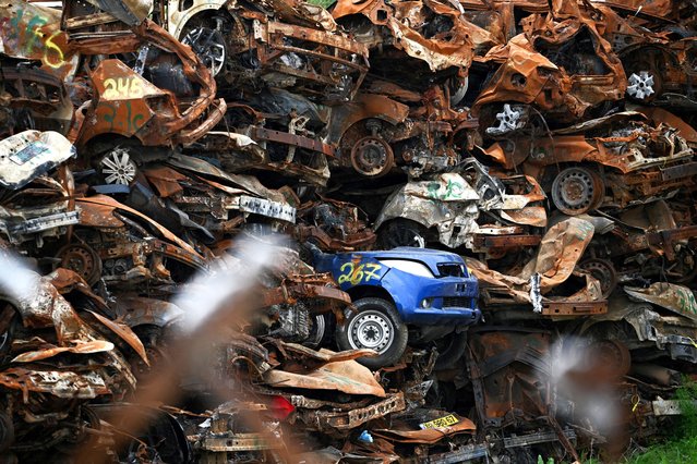 A collection of damaged cars lies abandoned since the deadly October 7 attack by gunmen from Palestinian militant group Hamas from the Gaza Strip, on a field near Netivot in southern Israel, on February 16, 2024. (Photo by Dylan Martinez/Reuters)