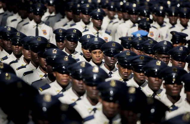 New members of the National Police parade during their graduation ceremony fromatthe Police Academy in Port-au-Prince, Haiti, Monday, December 18, 2017. The ceremony graduated over 1,000 new police officers, including 125 women. (Photo by Dieu Nalio Chery/AP Photo)