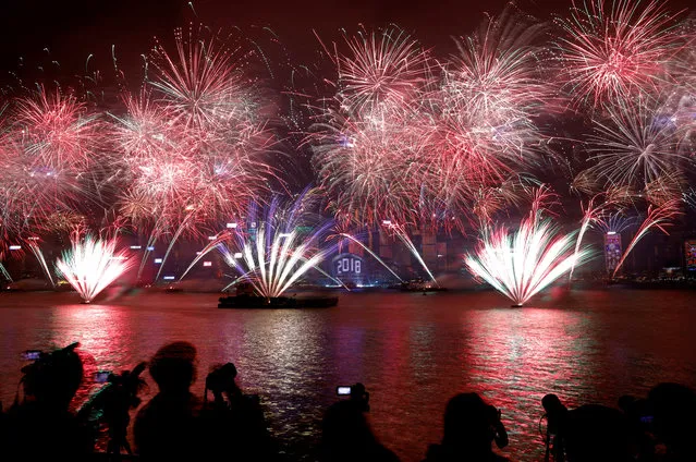 Fireworks explode over Victoria Harbour and Hong Kong Convention and Exhibition Centre during a pyrotechnic show to celebrate the New Year in Hong Kong on December 31, 2017. (Photo by Tyrone Siu/Reuters)