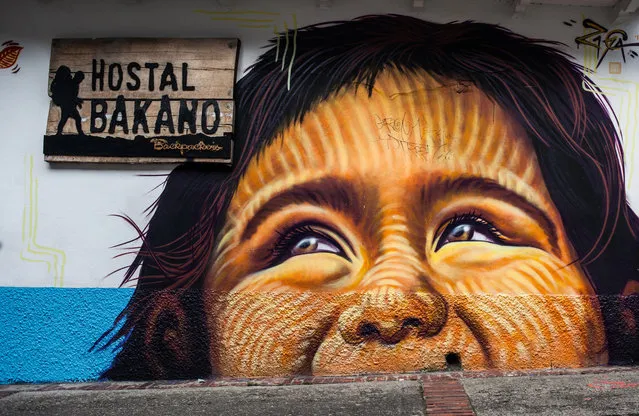 A graffiti displays an impressive mural of an indigenous kid at the Candelaria District in Bogota, Colombia on January 4, 2018. (Photo by Juancho Torres/Anadolu Agency/Getty Images)