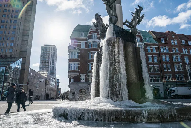 The water in a fountain frozen solid in central Malmo, Sweden, 26 February 2018. Media reports state that extreme cold weather is forecast to hit many parts of Europe with temperatures plummeting to a possible ten year low. (Photo by Johan Nilsson/EPA/EFE)