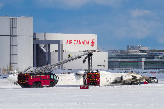 First responders work at the Delta Air Lines plane crash site at Toronto Pearson International Airport in Mississauga, Ontario, Canada on February 17, 2025. (Photo by Arlyn McAdorey/Reuters)