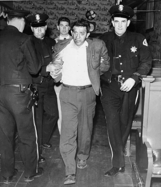 Joseph Gallo, known as “Crazy Joe Gallo”, is removed by police from a restaurant where Gallo fired 5 shots, killing a waitress, Mrs. Fern Burke, 41, in San Jose, Calif., March 17, 1955. Officers said Gallo fired 5 shots, three bullets striking the woman. (Photo by AP Photo)