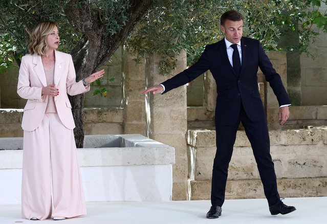 French President Emmanuel Macron is welcomed by Italy's Prime Minister Giorgia Meloni on the first day of the G7 summit, at the Borgo Egnazia resort, in Savelletri, Italy on June 13, 2024. (Photo by Guglielmo Mangiapane/Reuters)