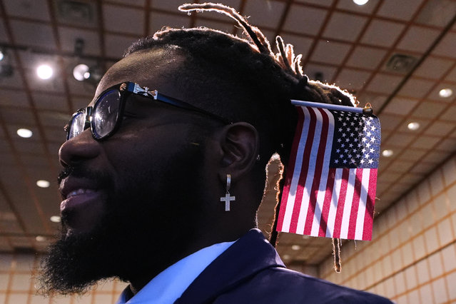 Gerson Brumaire, originally from Haiti, waits to receive his citizenship certificate following a naturalization ceremony, where nearly 200 people from 54 different countries became United States citizens, at the John F. Kennedy Presidential Library, Tuesday, November 18, 2025, in Boston. (Photo by Charles Krupa/AP Photo)