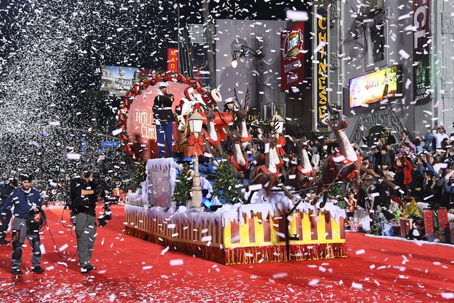 Marines for Toys For Tots and Cortney Lofton dressed as Santa Claus are seen during the 93rd Annual Hollywood Christmas Parade with Grand Marshal Luke Wilson in Support of Marine Toys for Tots Live Parade on November 30, 2025 in Hollywood, California. (Photo by Alberto E. Rodriguez/Getty Images for Hollywood Christmas Parade)