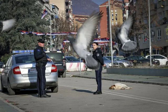 Kosovo police officers patrol on the bridge dividing southern Albanian and the northern, Serb-dominated part of ethnically divided town of Mitrovica, Kosovo, Thursday, December 29, 2022. A new mayor has been sworn in in northern Kosovo after a vote that was boycotted by the ethnic Serb minority which dominates the area. Erden Atic, who is from the Albanian majority, took up his post in the northern, Serb-dominated part of the divided city of Mitrovica on Friday, May 19, 2023 calling on citizens to cooperate. (Photo by Visar Kryeziu/AP Photo)