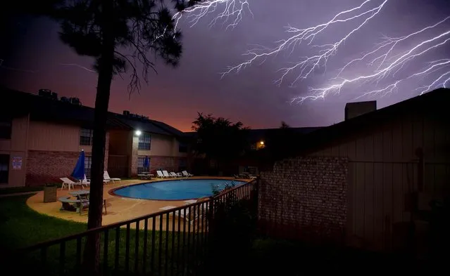 A lightning storm rolls across the sky over Odessa, Texas, on June 17, 2013. (Photo by Edyta Blaszczyk/Odessa American)