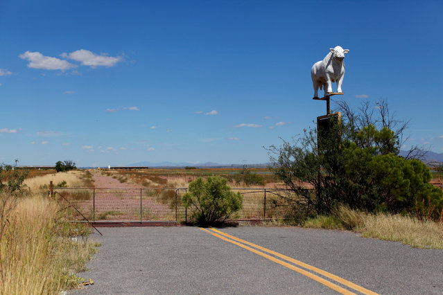 A road abruptly ends next to a sign for a cattle ranch near Douglas, Arizona, United States, October 10, 2016. (Photo by Mike Blake/Reuters)
