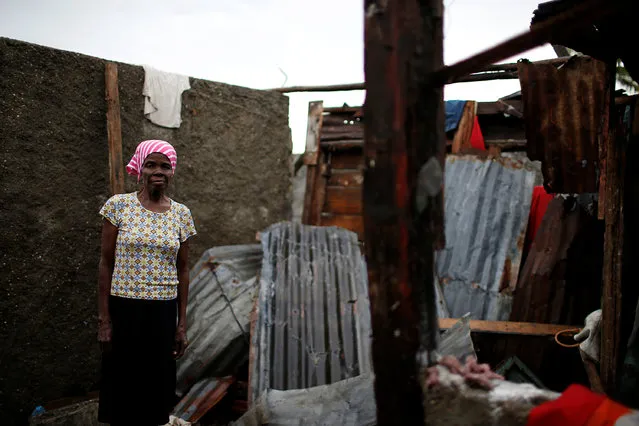 Rose-Marie Edmond, 74, poses for a photograph in her destroyed house after Hurricane Matthew hit Jeremie, Haiti, October 16, 2016. “I have no place to live, all my house is gone. I'm sleeping in a shelter and I haven't the strength to start again”, said Edmond. (Photo by Carlos Garcia Rawlins/Reuters)