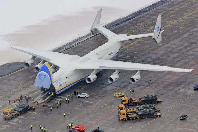 A tank is loaded onto an Antonov Airlines' An-225 Mriya aircraft, considered the largest aircraft in the world, at the Leos Janacek Airport in Mosnov, near Ostrava, Czech Republic, January 26, 2015. The tanks, which belong to a Czech company, are believed to be headed to Africa. (Photo by Robert Kolek/Reuters)