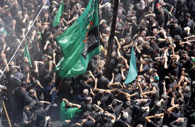Iranian and Iraqi Shiite Muslims re-enact the Battle of Karbala during the Ashura day ceremonies in Tehran, Iran, 28 July 2023. Shiite Muslims are observing the month of Muharram, the climax of which is the Ashura festival that commemorates the martyrdom of Imam Hussein, a grandson of the Prophet Mohammed, in the Iraqi city of Karbala in the seventh century. (Photo by Abedin Taherkenareh/EPA/EFE)