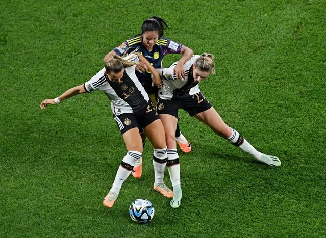 Lady Andrade of Colombia battles for the ball with Klara Buehl (L) and Jule Brand of Germany during the FIFA Women's World Cup Australia & New Zealand 2023 Group H match between Germany and Colombia at Sydney Football Stadium on July 30, 2023 in Sydney, Australia. (Photo by Jaimi Joy/Reuters)