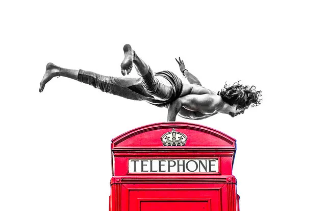 Yoga on top of a UK phone box, London. (Photo by Kristina Kashtanova/Caters News)