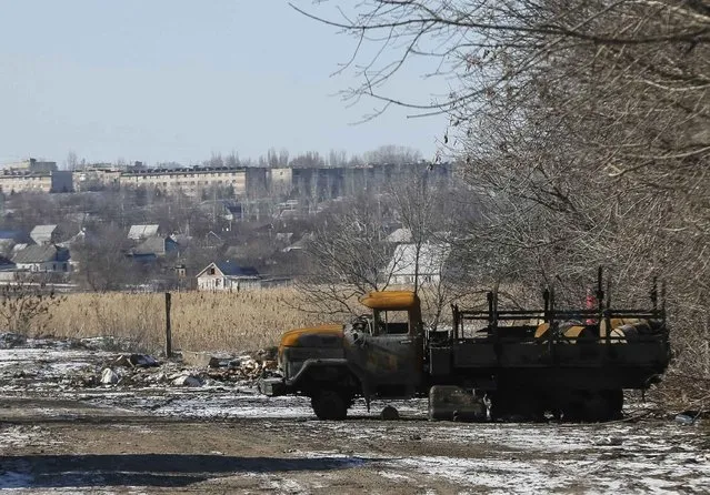 A burned military vehicle of the Ukrainian armed forces is seen near Debaltseve, eastern Ukraine, February 17, 2015. (Photo by Gleb Garanich/Reuters)