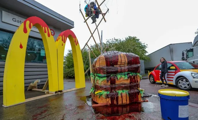 Protestors gather outside McDonald's distribution center in Hampstead Industrial estate in North London on the early morning of Saturday, May 22, 2021 – to blockade the site for at least 24 hours, using trucks and bamboo structures, causing a significant disruption to the McDonald's supply chain. (Photo by Vudi Xhymshiti/Anadolu Agency via Getty Images)