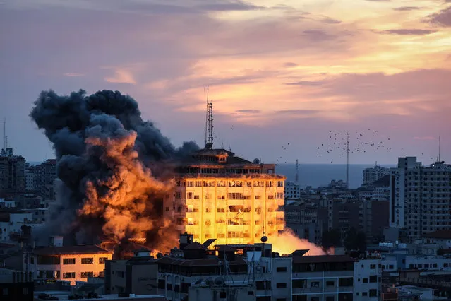 An Israeli strike destroys the Palestine Tower in the Al-Rimal neighborhood in the central Gaza Strip, Gaza, on October 7, 2023. (Photo by Loay Ayyoub/For The Washington Post)