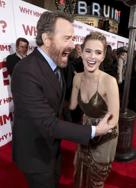 Bryan Cranston, left, and Zoey Deutch attend Twentieth Century Fox's world premiere of “Why Him?” at Regency Bruin Theater on Saturday, December 17, 2016, in Westwood, Calif. (Photo by [Eric Charbonneau/Invision for Twentieth Century Fox/AP Images)