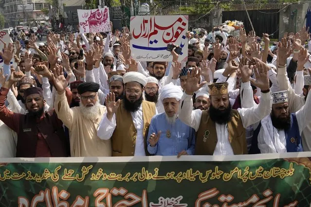 Supporters of a religious group hold a demonstration to condemn Friday's deadliest bombing in Lahore, Pakistan, Saturday, September 30, 2023. The banner read “we strongly condemn the brutality and suicide attack on peaceful procession in Baluchistan”. (Photo by K.M. Chaudary/AP Photo)