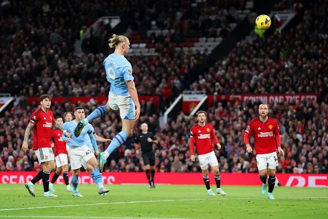 Erling Haaland of Manchester City scores the team's second goal during the Premier League match between Manchester United and Manchester City at Old Trafford on October 29, 2023 in Manchester, England. (Photo by Catherine Ivill/Getty Images)