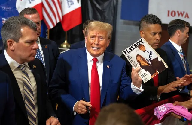 Former President Donald Trump signs items for a crowd of supporters at the Fort Dodge Senior High School on November 18, 2023 in Fort Dodge, Iowa. The former president spoke on various topics pertaining to things that happened during his term in office as well as current events. (Photo by Jim Vondruska/Getty Images)