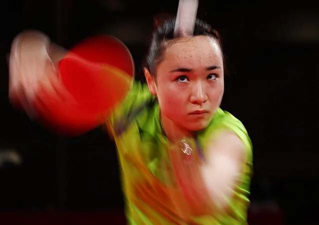 Japan's Mima Ito competes against Hong Kong's Doo Hoi-kem during their women's team semifinal table tennis match at the Tokyo Metropolitan Gymnasium during the Tokyo 2020 Olympic Games in Tokyo on August 3, 2021. (Photo by Thomas Peter/Reuters)