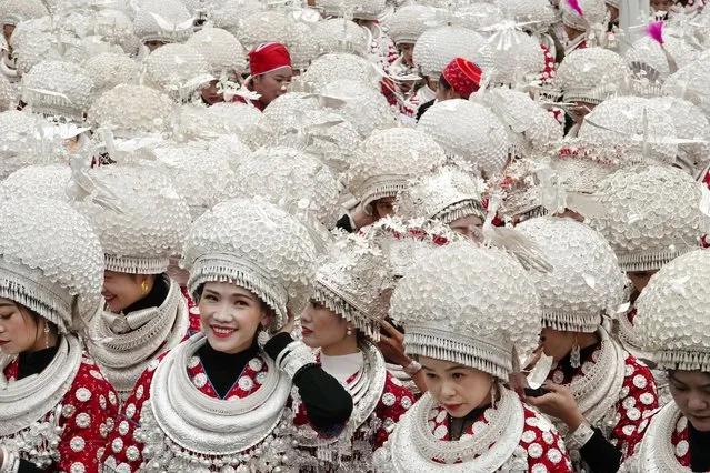 Girls of the Miao ethnic group wearing silver ornaments attend a parade to celebrate the Lusheng Festival on November 10, 2023 in Huangping County, Qiandongnan Miao and Dong Autonomous Prefecture, Guizhou Province of China. (Photo by Qin Gang/VCG via Getty Images)