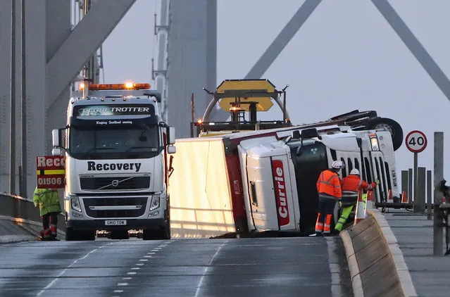 An overturned lorry on the Forth Road Bridge in Edinburgh, Scotland after high winds brought travel disruption and power cuts on January 11, 2017. (Photo by Andrew Milligan/PA Wire)